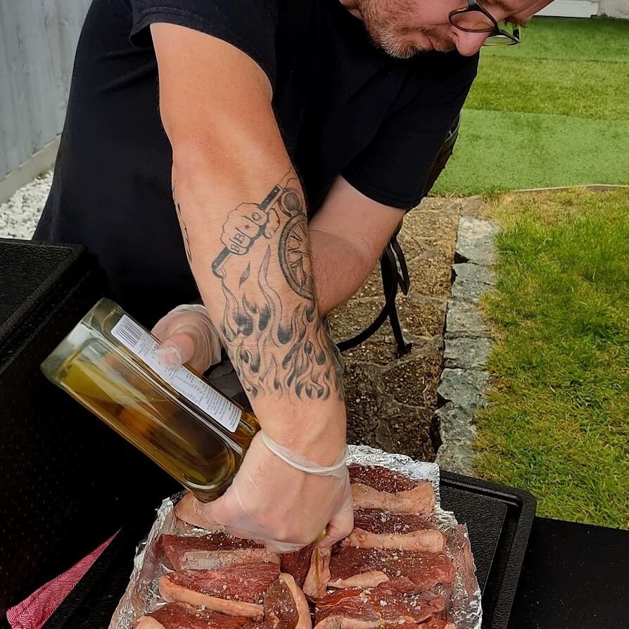 The Burb, seasoning Sirloin Steaks - Wedding Catering